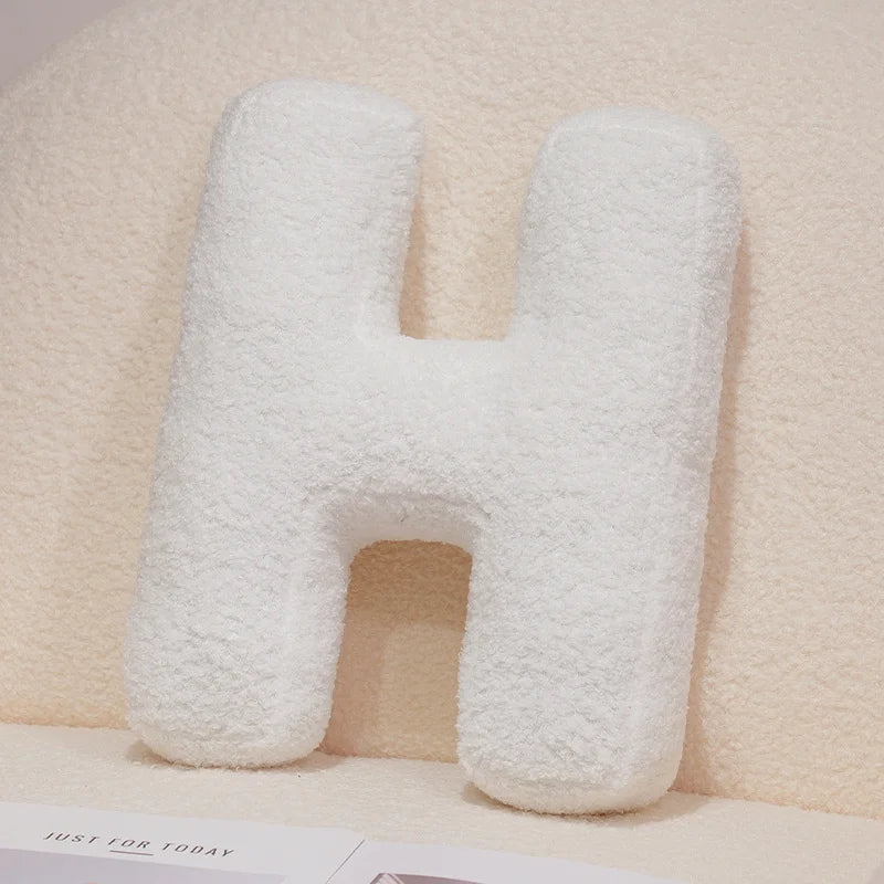 Coussins lettres blancs tout doux