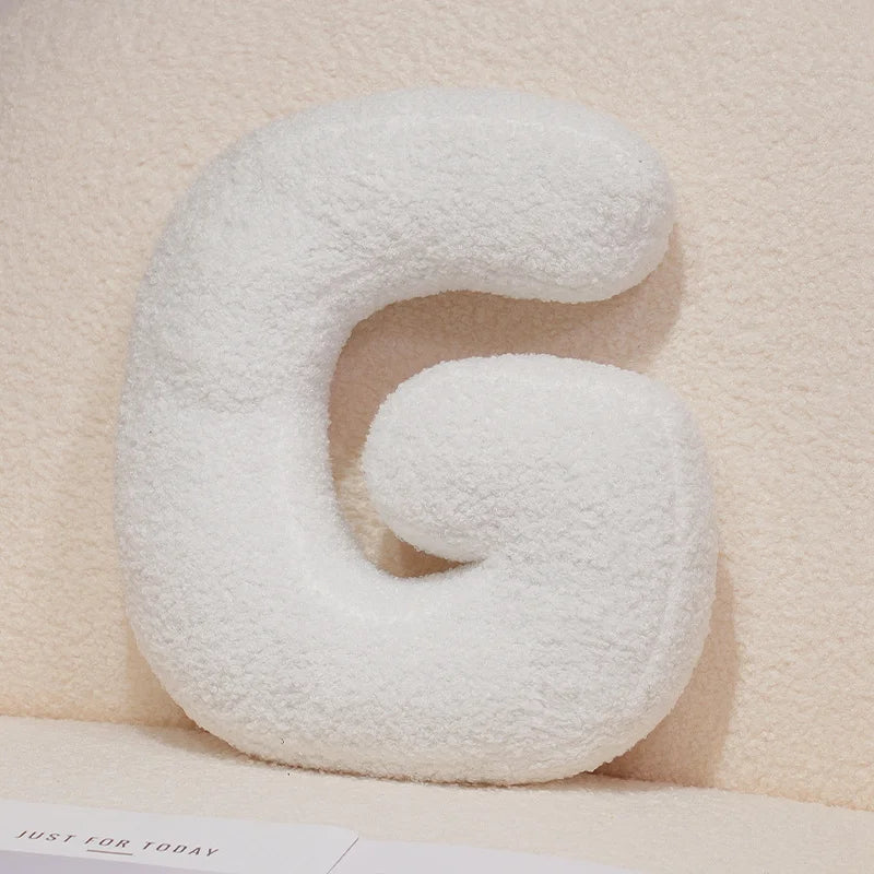 Coussins lettres blancs tout doux