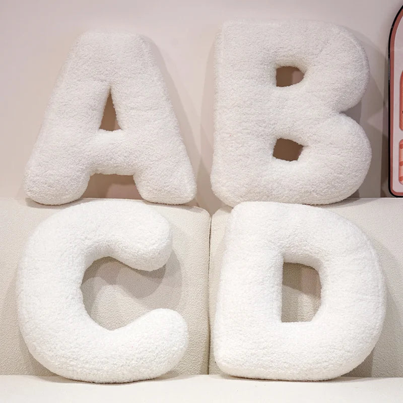 Coussins lettres blancs tout doux