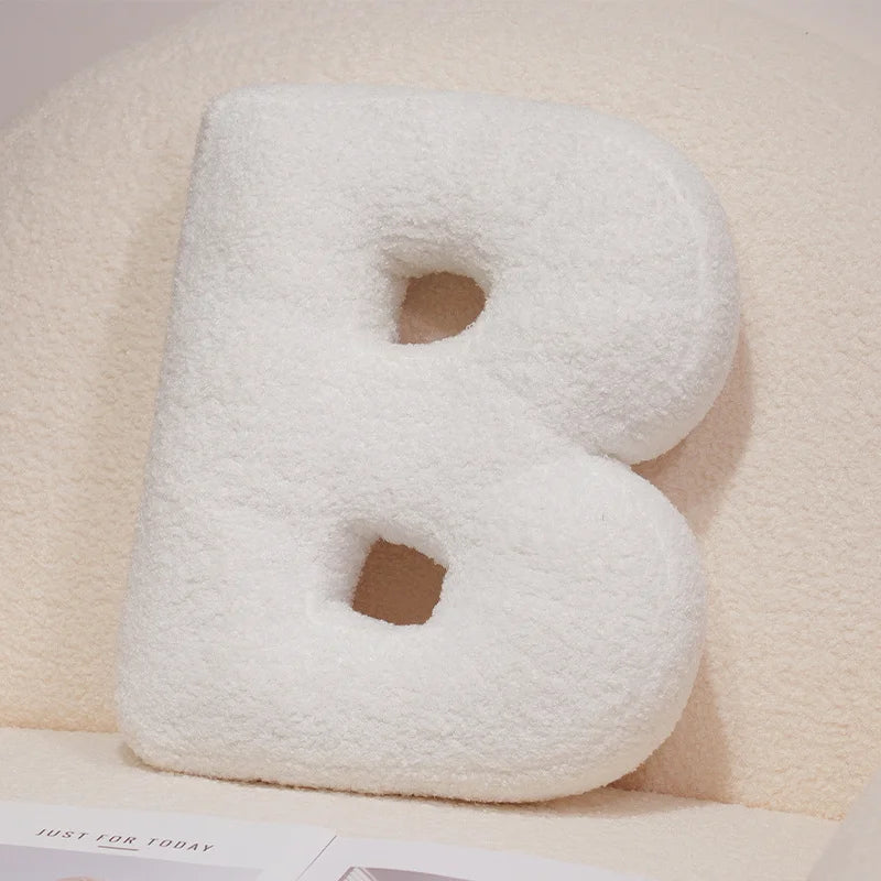 Coussins lettres blancs tout doux