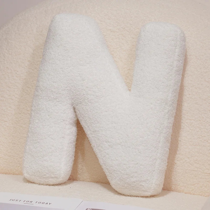 Coussins lettres blancs tout doux