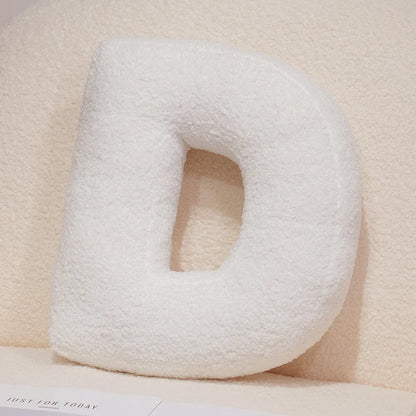 Coussins lettres blancs tout doux