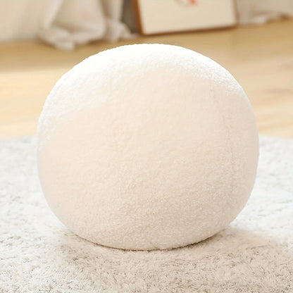 Coussins ronds en tissu bouclé