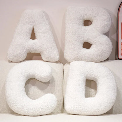 Coussins lettres blancs tout doux