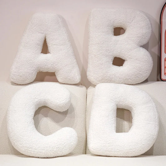 Coussins lettres blancs tout doux