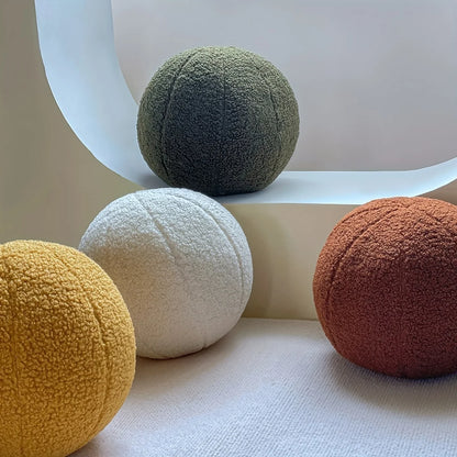 Coussins ronds en tissu bouclé
